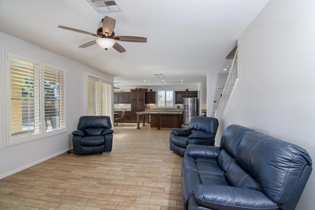 living room with ceiling fan