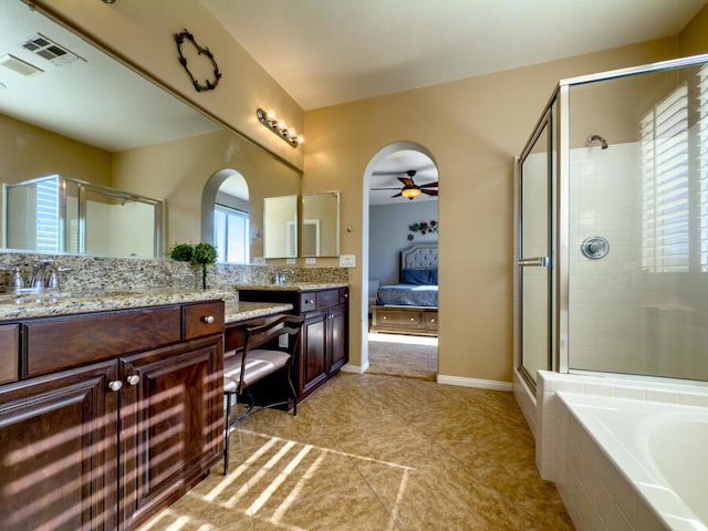 bathroom with tile patterned floors, ceiling fan, separate shower and tub, and vanity