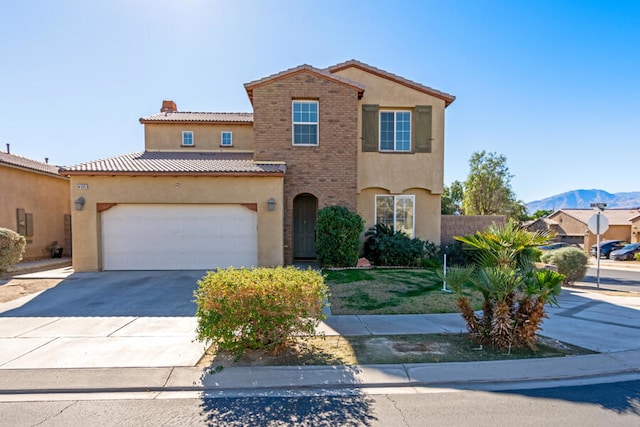 view of front of house featuring a mountain view and a garage