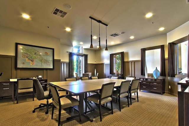 dining room with light colored carpet