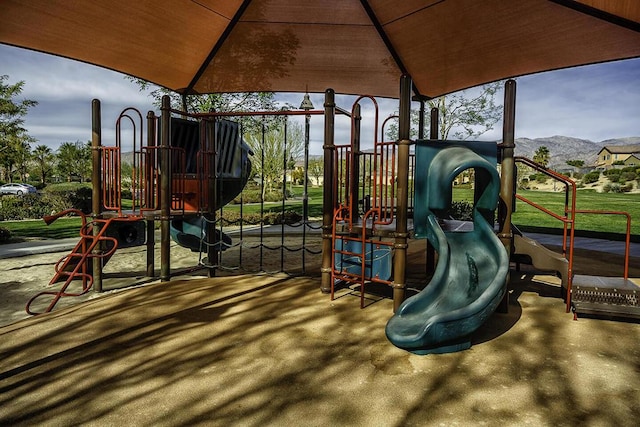 view of playground featuring a mountain view