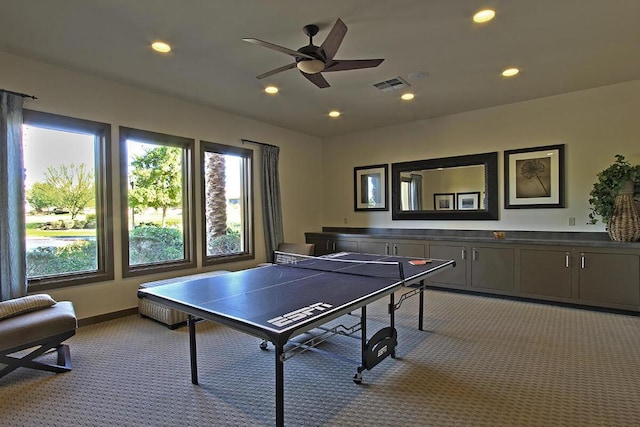 playroom with ceiling fan and light carpet