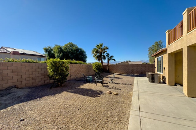 view of yard featuring a patio and cooling unit