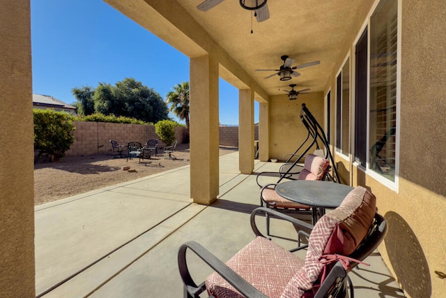 view of patio / terrace featuring ceiling fan