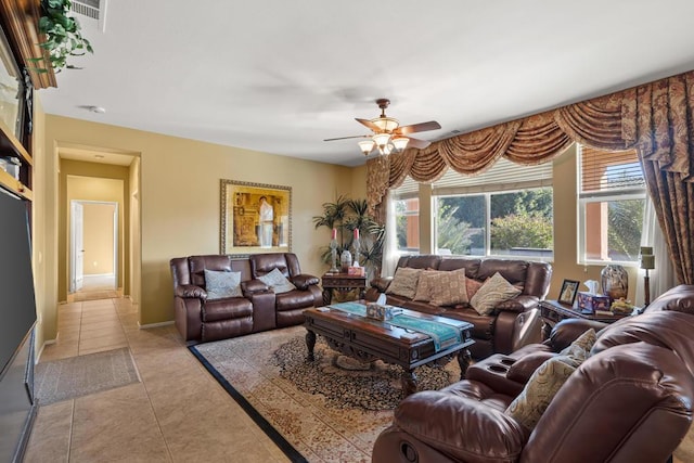 living room featuring ceiling fan and light tile patterned flooring