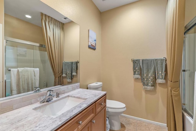 full bathroom with tile patterned floors, vanity, enclosed tub / shower combo, and toilet