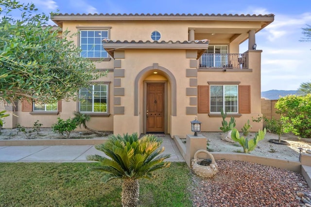 mediterranean / spanish-style house featuring a balcony