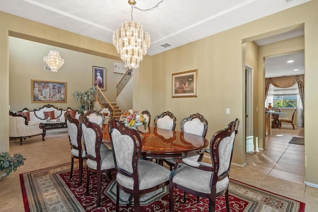 tiled dining area with an inviting chandelier