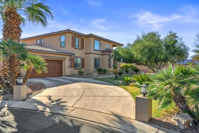 mediterranean / spanish-style house featuring a garage