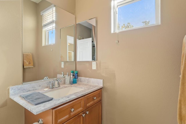 bathroom featuring vanity and a wealth of natural light