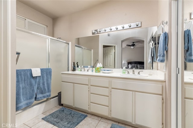 bathroom with vanity, ceiling fan, tile patterned floors, and walk in shower