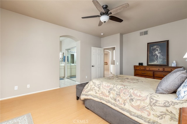 bedroom featuring ceiling fan and connected bathroom