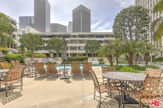 view of patio featuring a community pool