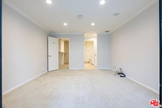 carpeted spare room with ornamental molding