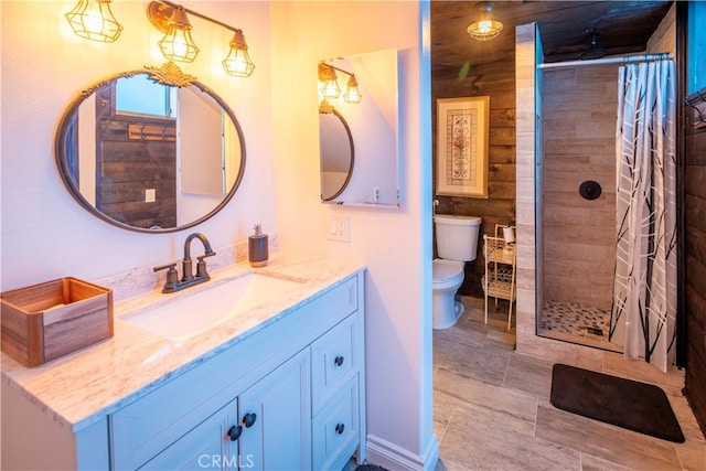 bathroom with a shower with shower curtain, vanity, and toilet