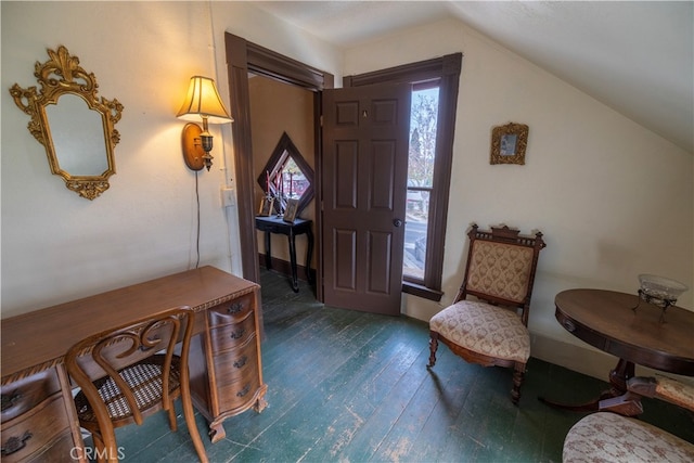 foyer entrance featuring lofted ceiling and dark wood-type flooring