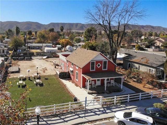 drone / aerial view featuring a mountain view