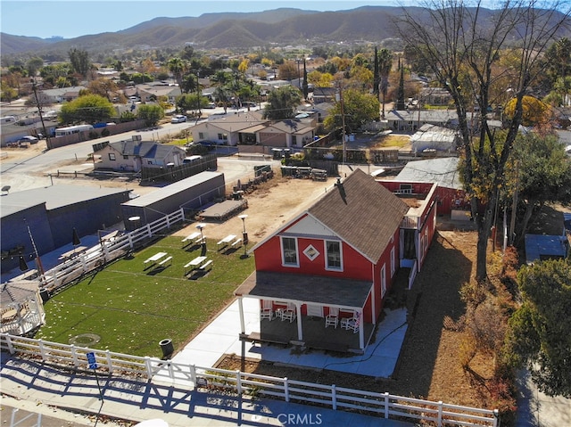 birds eye view of property featuring a mountain view