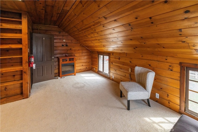 sitting room with light carpet, vaulted ceiling, wood walls, and wood ceiling