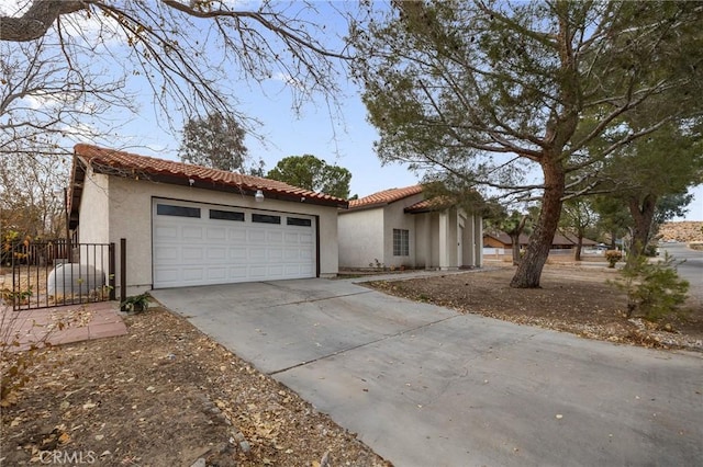 mediterranean / spanish house featuring a garage