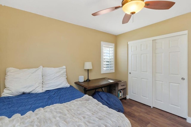 bedroom featuring a closet, dark hardwood / wood-style floors, and ceiling fan