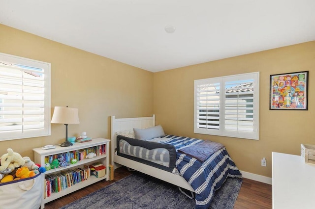 bedroom featuring dark wood-type flooring