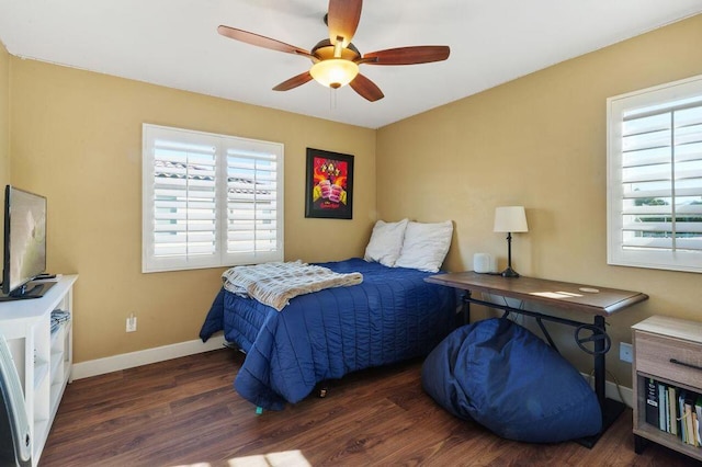 bedroom with ceiling fan and dark hardwood / wood-style flooring