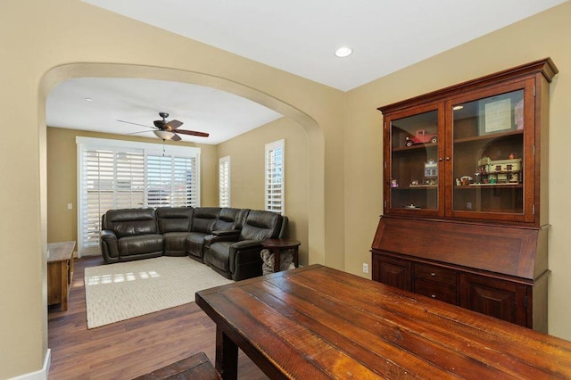 living room with hardwood / wood-style floors and ceiling fan