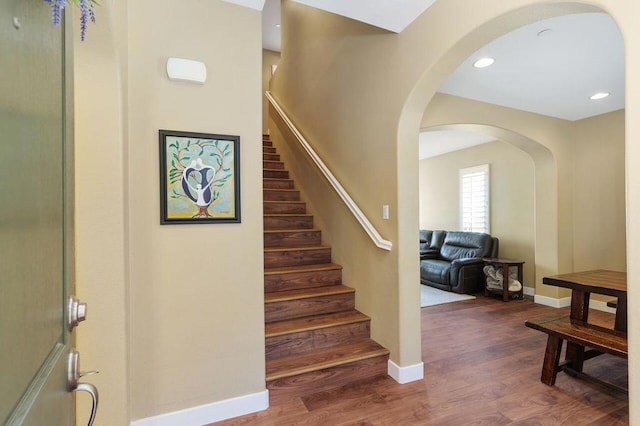 stairway with wood-type flooring