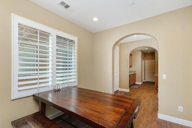 dining space featuring hardwood / wood-style floors