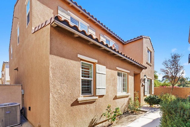 view of home's exterior with central AC