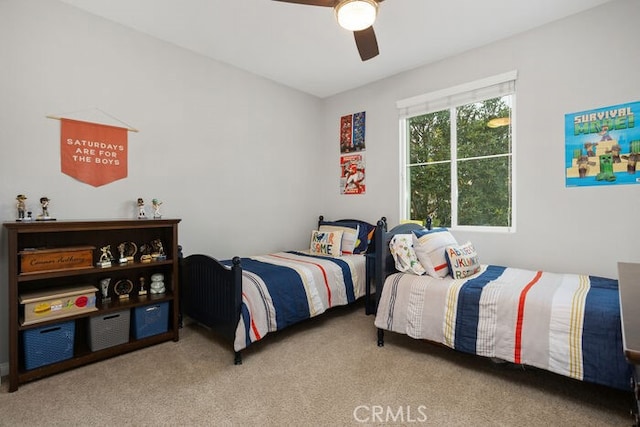 bedroom with ceiling fan and carpet flooring