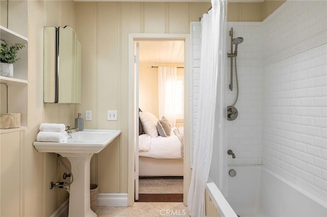 bathroom with tile patterned floors and shower / bathtub combination with curtain