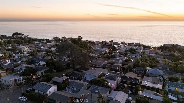 aerial view at dusk with a water view