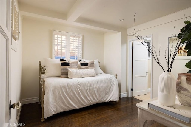 bedroom with dark hardwood / wood-style flooring