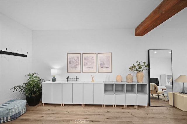 1440 Veteran Ave Unit 241, Los Angeles, CA 90024 - miscellaneous room with light wood finished floors and beamed ceiling