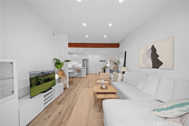 1440 Veteran Ave Unit 241, Los Angeles, CA 90024 - living area featuring light wood finished floors, recessed lighting, and beam ceiling