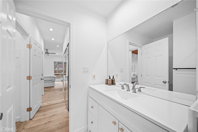 1440 Veteran Ave Unit 241, Los Angeles, CA 90024 - bathroom with wood finished floors, vanity, and recessed lighting