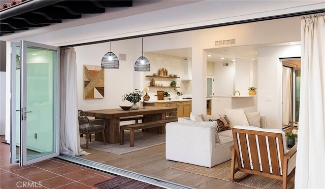 interior space with pendant lighting and dark hardwood / wood-style floors