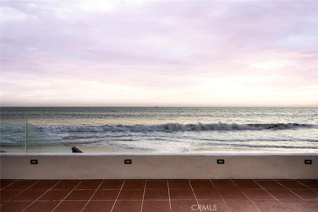 property view of water featuring a beach view