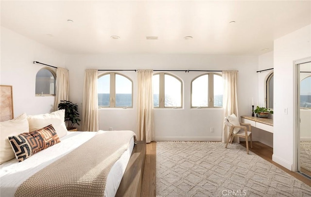 bedroom featuring light wood-type flooring