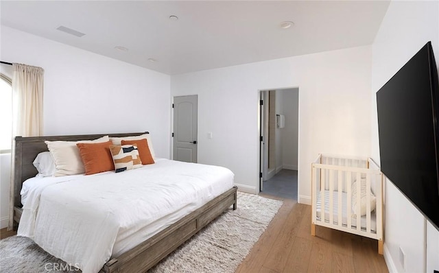 bedroom with light wood-type flooring