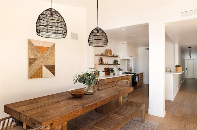 dining area featuring wood-type flooring