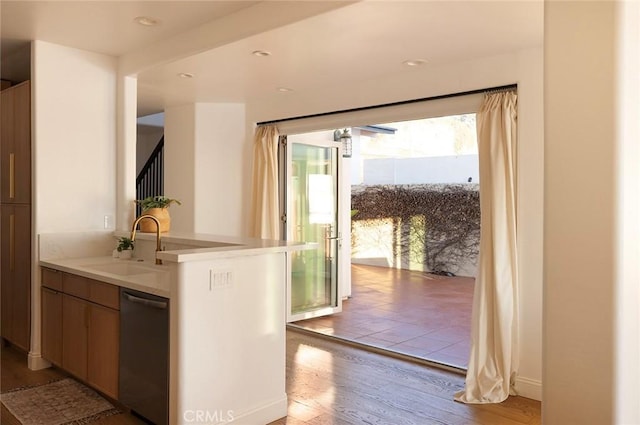 interior space with light hardwood / wood-style flooring and sink