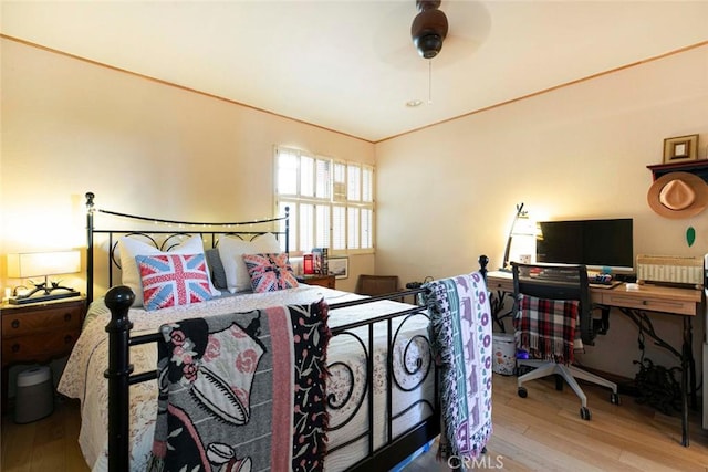 bedroom featuring wood-type flooring and ceiling fan