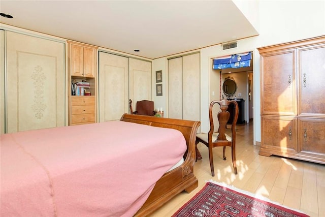 bedroom with light hardwood / wood-style floors