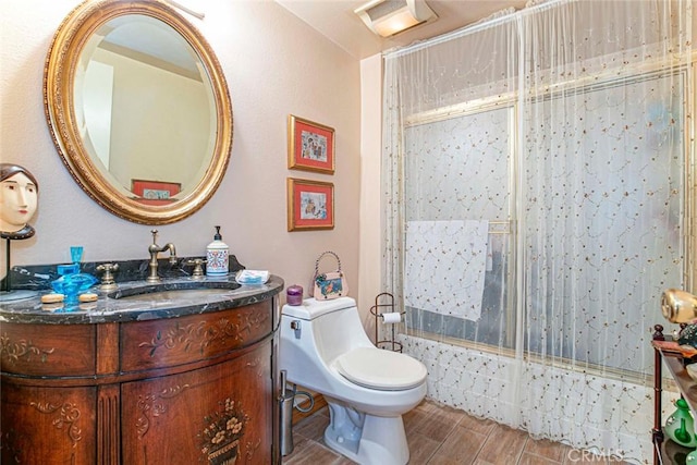 bathroom with hardwood / wood-style flooring, vanity, and toilet