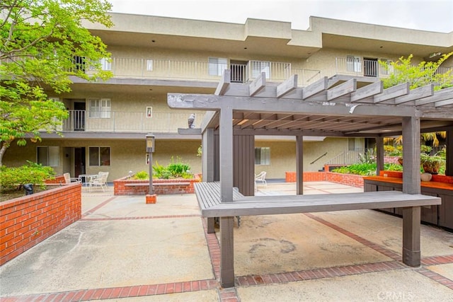 view of patio featuring a pergola