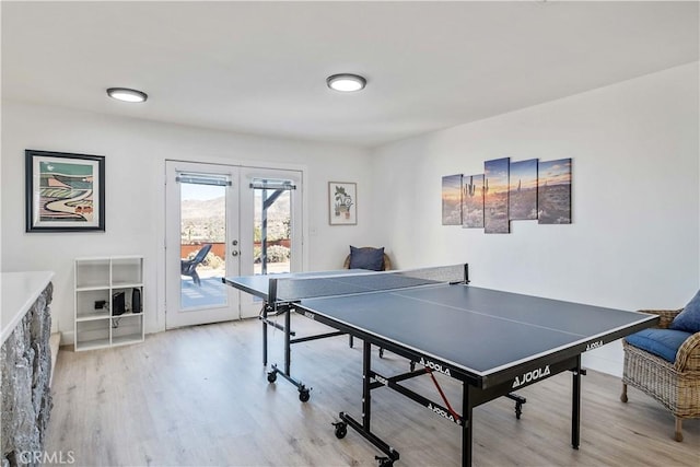 rec room featuring light hardwood / wood-style floors and french doors