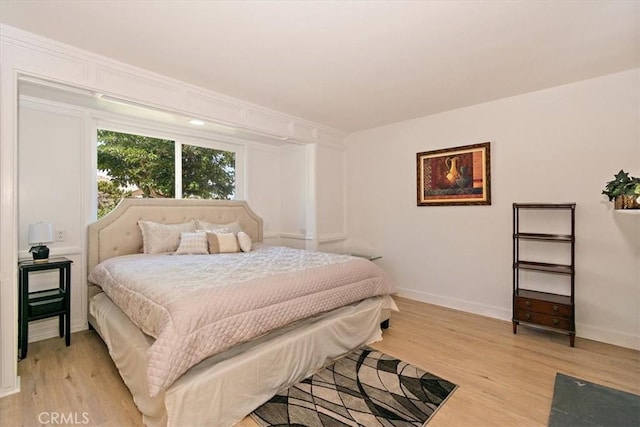 bedroom with light hardwood / wood-style flooring